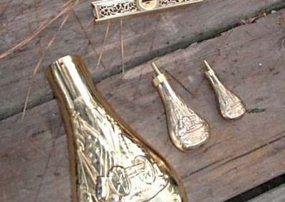 Several miniature powder flasks made by Paul.