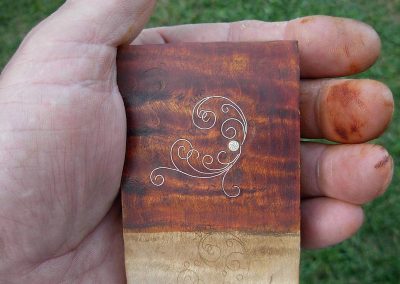 The silver inlay is pressed into a slot carved into the final workpiece.
