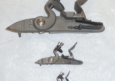 Three different sized firing mechanisms.