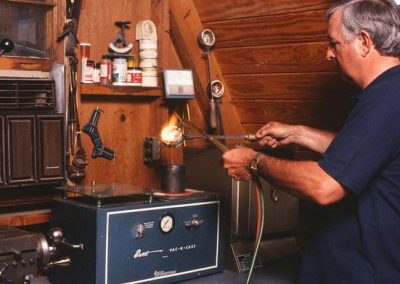 Paul pours raw metal to cast some parts.