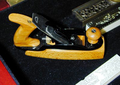 A miniature wooden block plane.