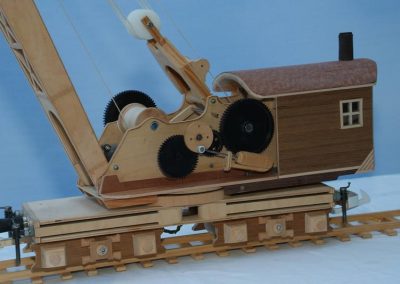 A crane car on the tracks.