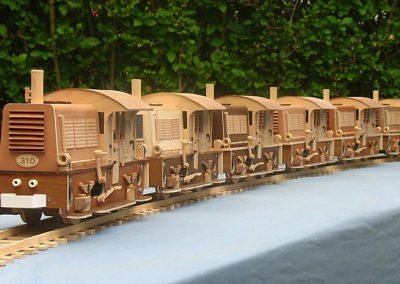 Six identical Diesel switchers on the track.