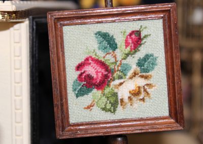 Miniature petit point artwork.