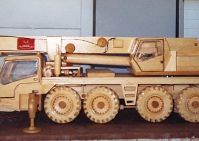 A wooden four-axle crane truck.