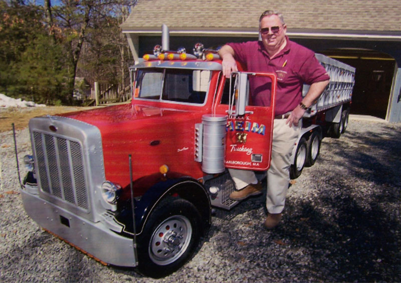 Fred Heim With His 1/2 Scale Peterbilt Fred stands with his large 1/2 scale Peterbilt tractor.