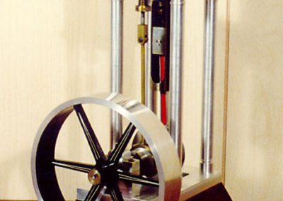 An open column stationary steam engine made by Rudy.