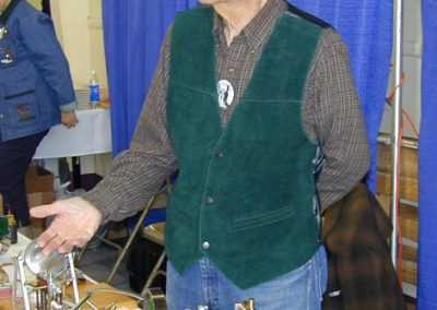 Rudy explaining some of his engines at a show.