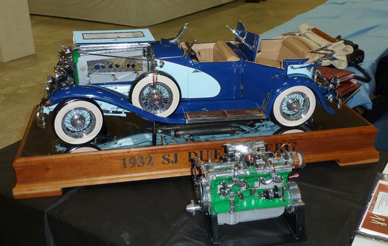 The Finished Duesenberg The finished 1/6 scale Duesenberg sits on display with its Liberty V-12 in front.