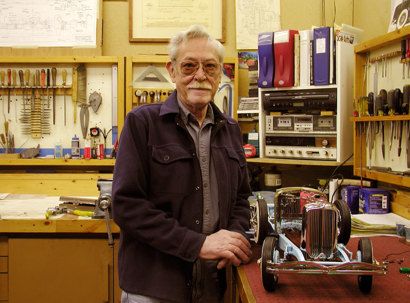 Lou With the Partially Completed Duesenberg Lou Chenot stands in his shop with the partially completed Duesenberg.