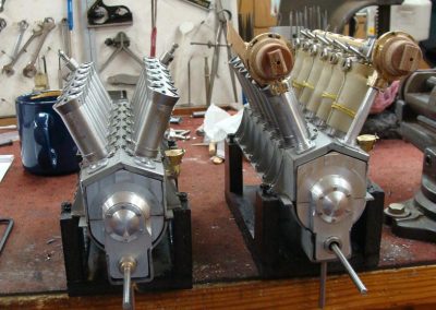 Two scale Liberty V-12 engines under construction.