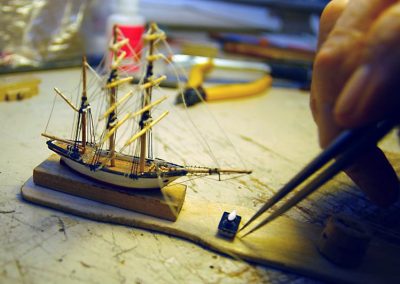 Phil rigging a ship model.