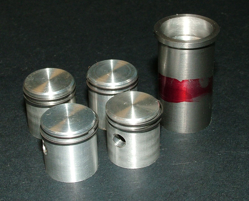 Ron's Pistons With Rings. Ron's finished pistons with rings for the Seal Engine Project.