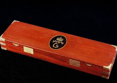 The finely made mahogany case for Michel's miniature blunderbuss.