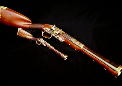 Michel's 1/3 scale miniature blunderbuss sits below the full-size original.