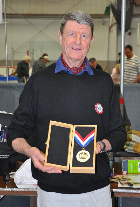 Michel Lefaivre Receiving His Craftsman of the Year Award Michel holding his commemorative gold medallion.