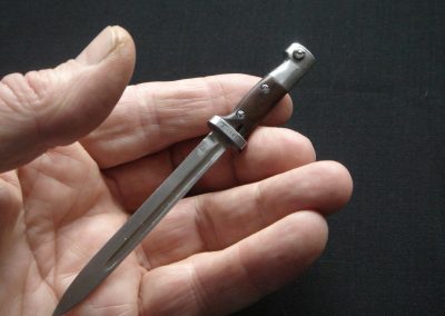 Michel holds his scale bayonet for the Mauser in his hand.
