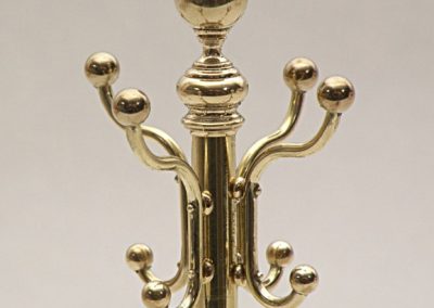 The top section of the brass coat rack.