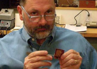 Bill at his workbench finishing up a miniature cabinet.