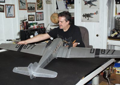 Mr. Rojas-Bazan stands with his finished model in the studio.