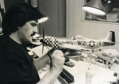 Guillermo with a model of the P-51 Mustang known as, “Big Beatiful Doll.”