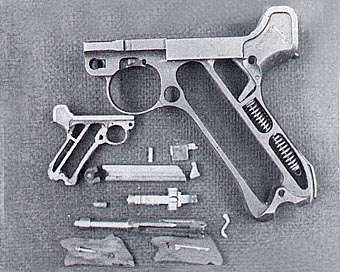 Full-Size and Miniature Luger Frames A full-size Luger P.08 frame alongside David’s miniature frame and related pieces.