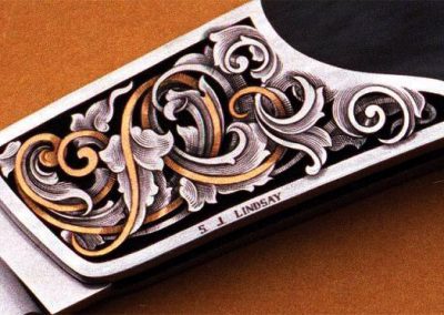 Another folding knife engraved by Steve.