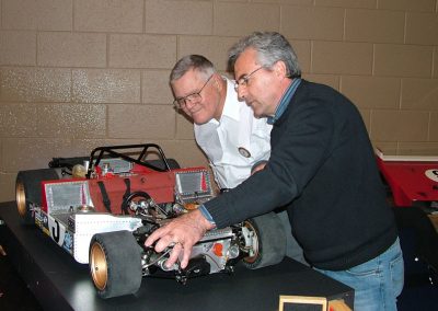 Joe Martin (left) watches the tach as Pierre pushes in the gas pedal to rev the engine.