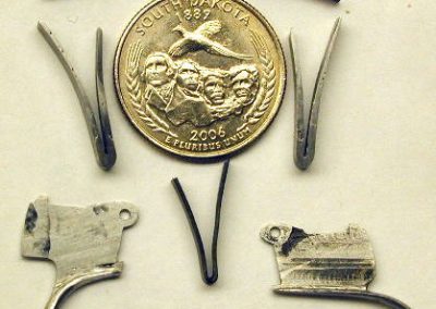 Although the mechanism of a double-barreled shotgun may seem simple, there are actually many pins, springs, and parts.