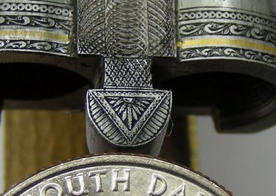 A close-up of the “doll’s head” near the receiver end of the barrel.