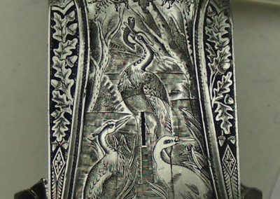 The bottom of the receiver incorporates a very detailed hunting scene.