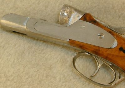 This photo shows the receiver and trigger mechanisms installed on the carved wood stock.