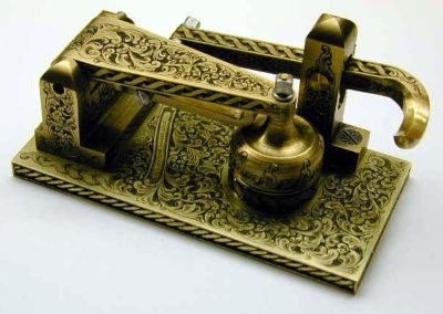 An ornate oiler made and engraved by Roger.