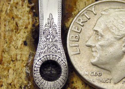 Extremely fine engraving on the top tang.