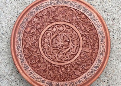 A carved wooden plate made by Roger.