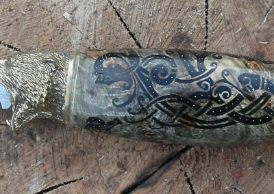 A bear head knife made by Roger.