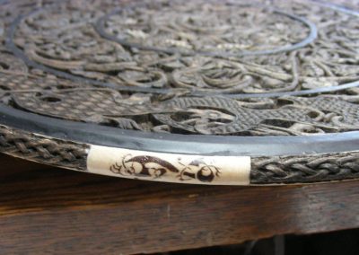 A close look at the carved wooden plate.