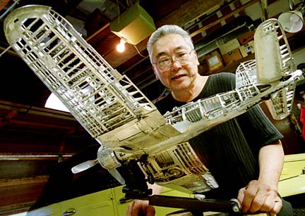 Young With His Corsair Mr. Park stands behind his nearly completed model Corsair.