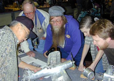 Mr. Park (left) is seen showing his models to the crowd.