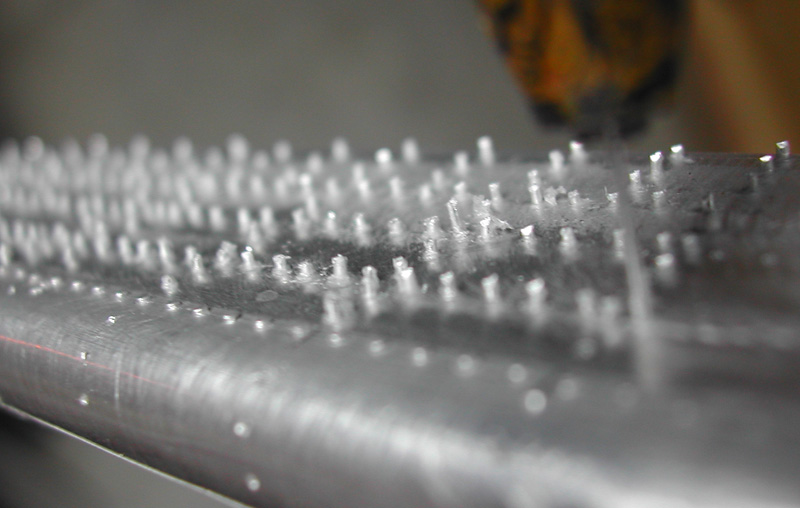 False Rivets These false rivets made from soft aluminum wire are pushed into holes in the wings.