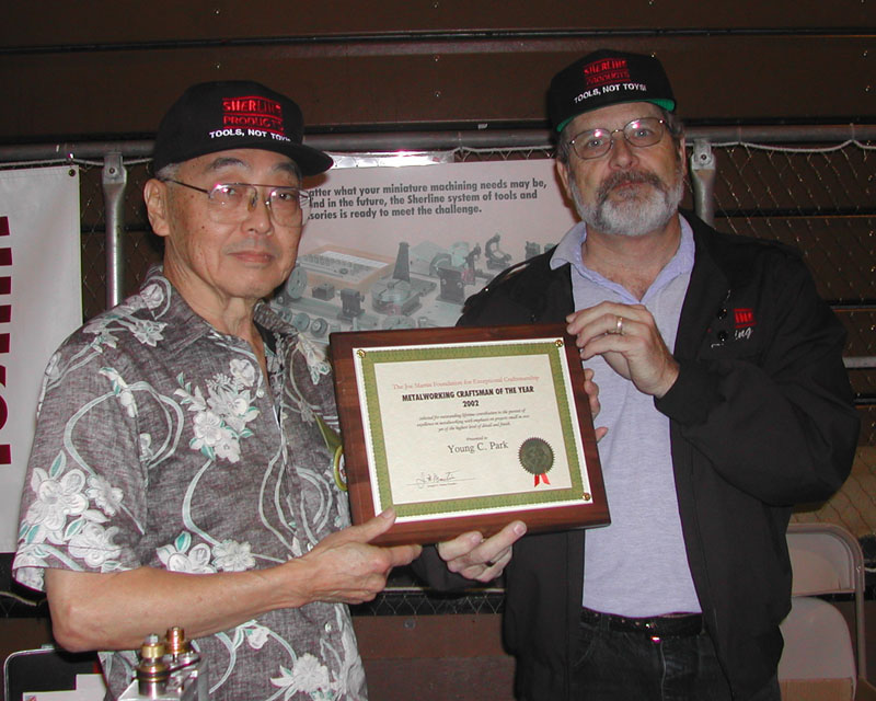 Young Accepting His Award Young Park (left) accepting his Craftsman of the Year Award.