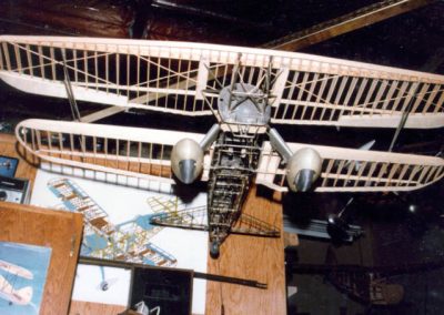 The scale Curtiss biplane in flight.