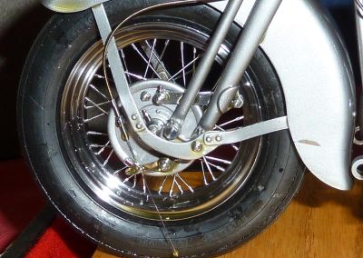 A close-up of the tire, wheel, brake, and fender.
