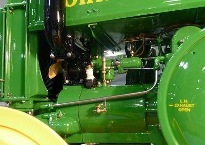 The scale model John Deere tractor engine.