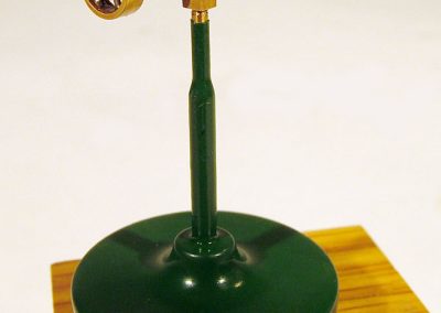 Jerry’s microscopic engine sits atop a custom stand.
