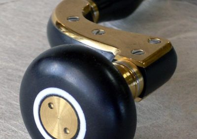 An Ultimatum brace made with ebony and brass.