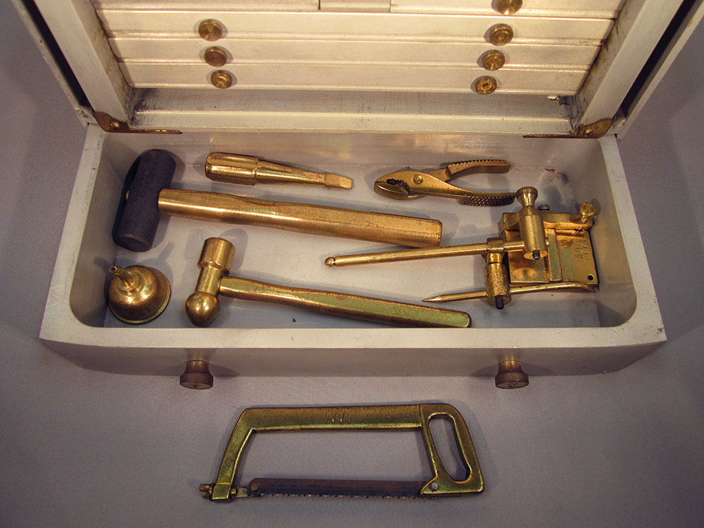 Miniature Machinist’s Toolbox This drawer reveals a miniature hacksaw, hammer, mallet, and other tools.