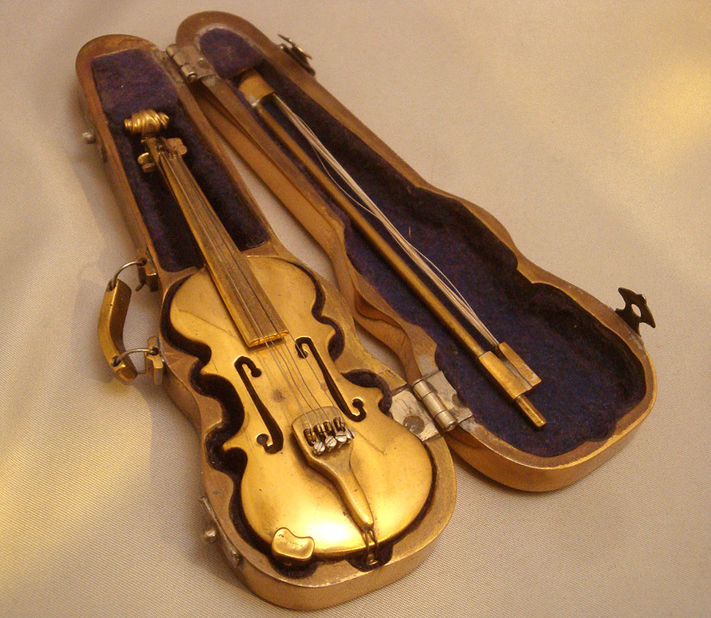Miniature Violin Abraham's miniature violin sits in its open case.
