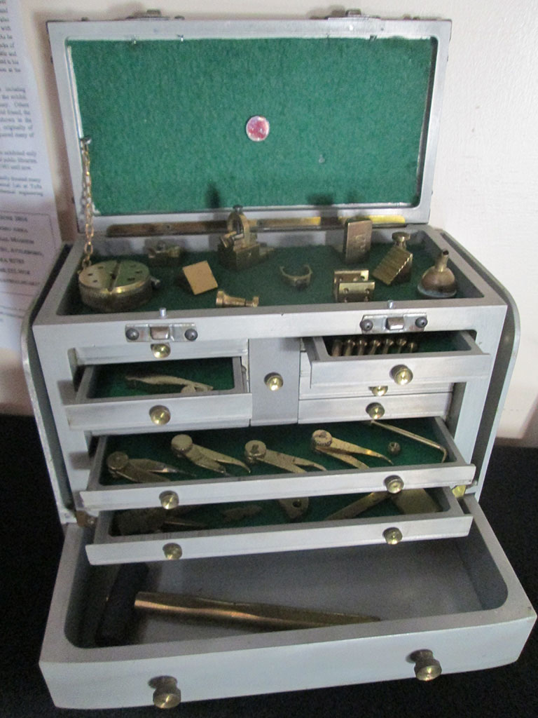 Miniature Machinist’s Toolbox The open, felt-lined drawers reveal a number of miniature machinist's tools.