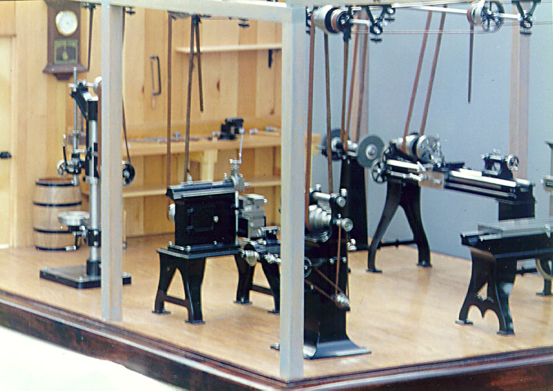 1/6 Scale Machine Shop The overhead belt drive system is visible in this wide view of the miniature shop.